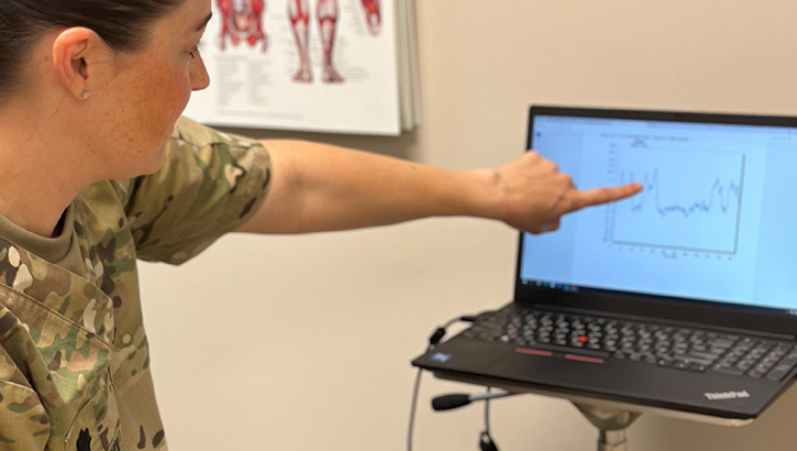 U.S. Army Lt Col. (Dr.) Leigh Anne Lechanski, department chief of rehabilitation at Eisenhower Army Medical Center, guides a patient through a pelvic floor muscle exercise training session using a surface electromyography biofeedback system. This intervention gives patients a visual aid and objective information about muscle activation in the pelvic floor structures. (Courtesy Photo)