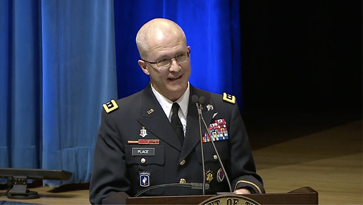 Defense Health Agency Director Army Lt. Gen. Ronald Place speaks at a podium.