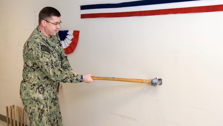 Naval Medical Center Portsmouth (NMCP) hosts an OR (operating room) construction project groundbreaking ceremony, Jan. 18. First up with a sledgehammer to officially start the renovation was Capt. Brian L. Feldman, NMCP director/Navy Medicine Readiness and Training Command Portsmouth (NMRTC) commander.  (Photo: Petty Officer 2nd Class Dylan Kinee) 