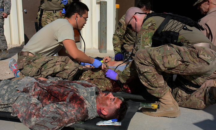Medical teams assigned to the 379th Expeditionary Medical Group care for patients during a mass-casualty exercise at Al Udeid Air Base, Qatar. The exercise provided medical teams with an opportunity to provide care for patients in a mass-casualty situation. Teams were evaluated on set up, patient movement and communication. (U.S. Air Force photo by Tech. Sgt. James Hodgman)
