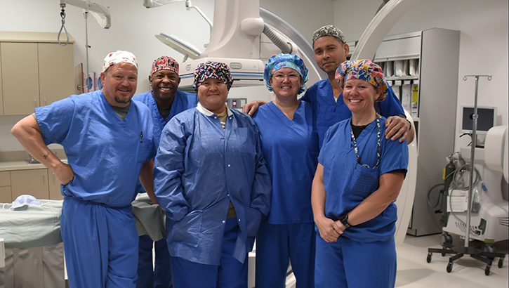 The Womack Army Medical Center team implements new lifesaving techniques using interventional radiology. (Left to right) IR technologist, Timmothy Baker, and Anthony Buckmon, Natascha Faircloth, IR nurse supervisor, U.S. Army Col. Kirk Russell, interventional radiologist, and Tammy Wasserman, IR tech. (Photo by Keisha Frith)