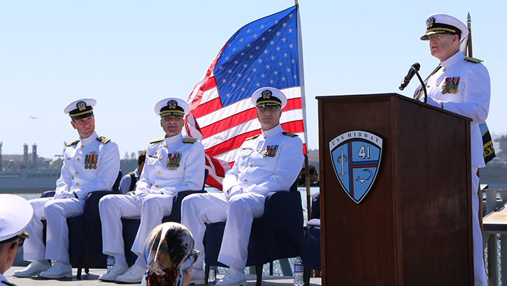 Retired Rear Adm. David Malone delivers the keynote address during Rear Adm. Frank Brajevic’s promotion ceremony aboard the USS Midway 