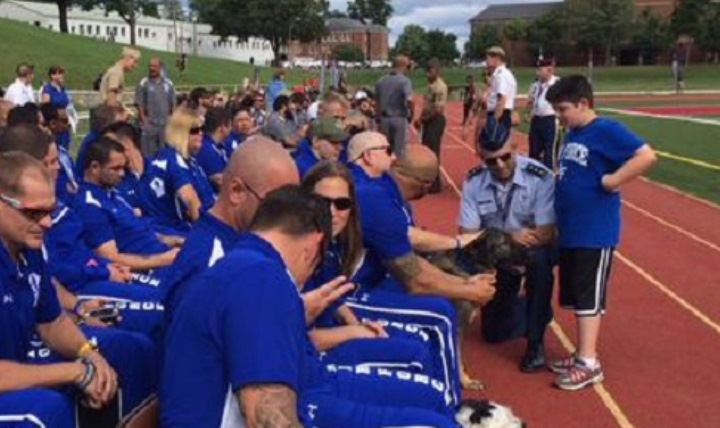 Defense Health Agency Director Air Force Lt. Gen. Douglas Robb and his son, Luke, meet with Team Air Force briefly before closing ceremony for the 2015 Warrior Games at Marine Corps Base Quantico, Virginia, on June 28, 2015. 