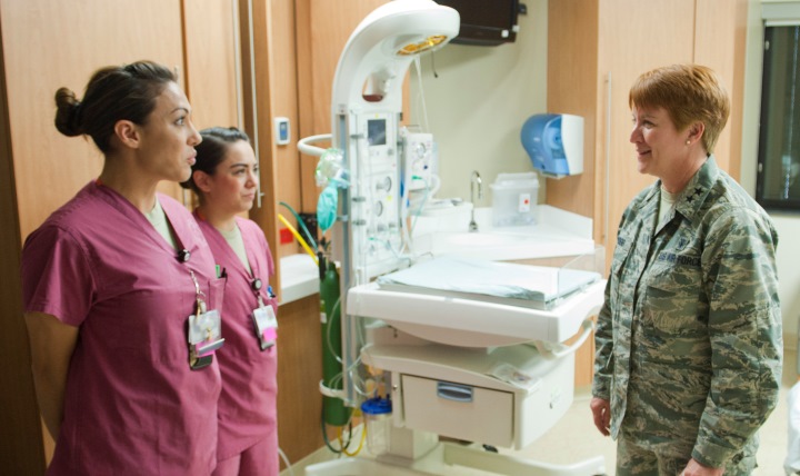 Second Lt. Theresa Jacobs-Bruner (left), 99th Inpatient Operations Squadron labor and delivery nurse, and Senior Airman Kayla Mills (center), 99th IPTS labor and delivery technician, brief Maj. Gen. Dorothy Hogg, U.S. Air Force director of medical operations and research and chief of the nurse corps, on the operations and capabilities of the labor and delivery ward at the Mike O’Callaghan Federal Medical Center, Nellis Air Force Base, Nev., Jan. 13, 2015. Hogg was visiting Nellis and the nearby University Medical Center of Southern Nevada to discuss the benefits of the Sustained Medical and Readiness Trained, or SMART, program. (U.S. Air Force photo illustration by Senior Airman Thomas Spangler)