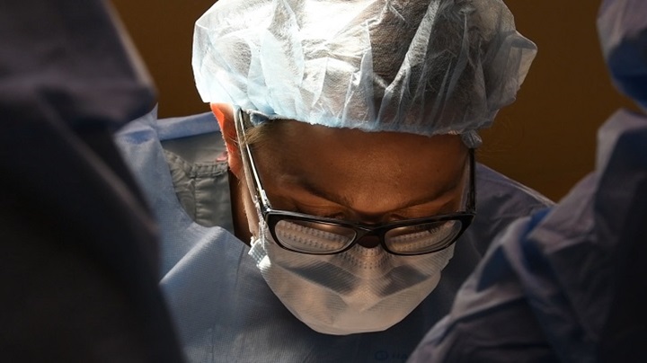 Image of Man in hospital garb.