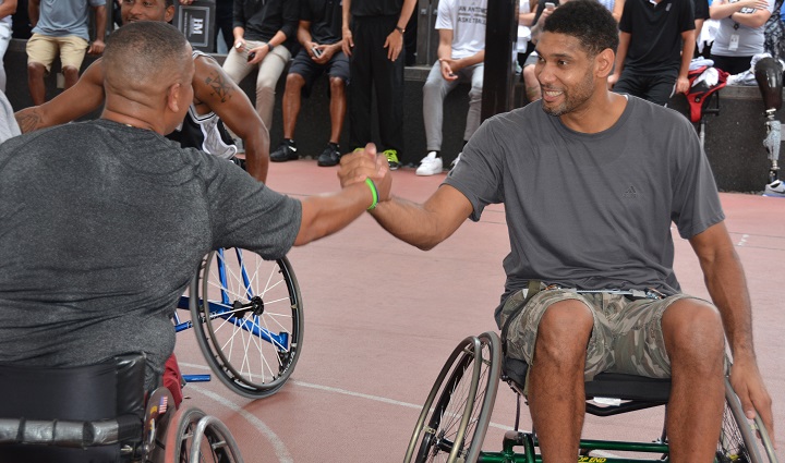 San Antonio Spurs forward, Tim Duncan, congratulates a wounded warrior after a game of wheelchair basketball at the Center for the Intrepid. (U.S. Army photo by Robert Shields)