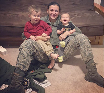 Military personnel posing with their children 