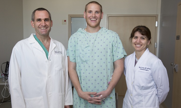Left to right: Dr. Garth Utter, an associate professor of surgery, Airman 1st Class Spencer Stone and Capt. Eleanor Curtis, a senior resident at UC Davis Medical Center who is assigned to David Grant USAF Medical Center at Travis Air Force Base, Calif., pose for a photo in October. (Courtesy photo)