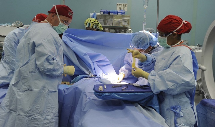 A surgical team aboard the hospital ship USNS Comfort performs surgery on a patient during Continuing Promise 2015. The Navy is looking into the viability of conducting successful select surgeries during high seas on alternative platforms, such as littoral combat ships or high speed vessels. 