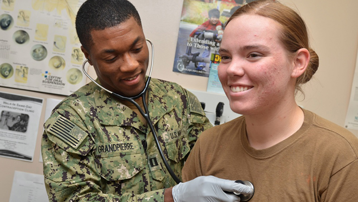 Navy Lt. Karl Yves Marie Grand Pierre, a physician assistant at Naval Branch Health Clinic Kings Bay, Georgia, checks Seaman Ashley Jackett’s heart. DoD recommends that all service members and beneficiaries do just that: listen to your heart and build healthy heart habits. (U.S. Navy photo by Jacob Sippel, Naval Hospital Jacksonville)