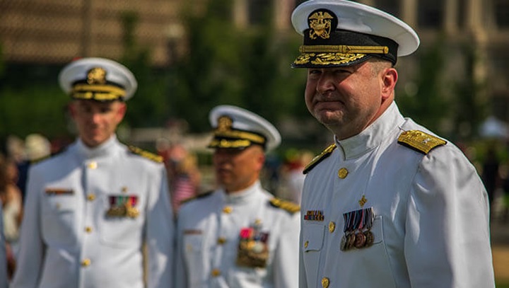 Image of Rear Admiral Brandon Taylor of the U.S. Public Health Service Commissioned Corps in dress whites at the 2019 National Independence Day Parade where he represented the U.S. Surgeon General as a presiding official with the other services. Taylor was named in February as the new director of the Defense Health Agency’s Public Health directorate. (Photo: Tanisha Blaise, Armed Forces Health Surveillance Division senior public relations and media specialist) .