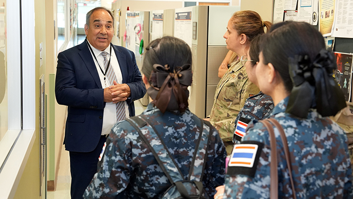 Dr. Darrin Frye, chief science director, Naval Medical Research Unit (NAMRU) San Antonio, gives a tour of research facilities to flight nurses from the Royal Thai Air Force at the Battlefield Health and Trauma Research Institute
