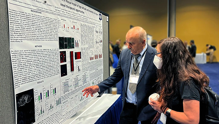 Researchers at an exhibit at the Military Health System Symposium