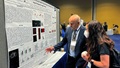 Researchers at an exhibit at the Military Health System Symposium