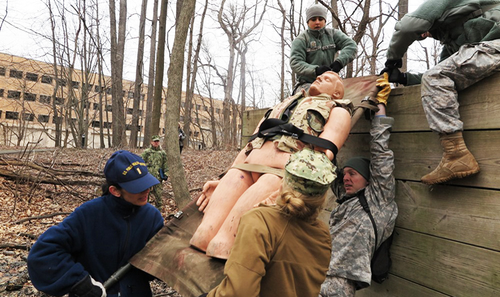 Students at the Uniformed Services University of the Health Sciences go through an exercise to test their combat casualty care skills.