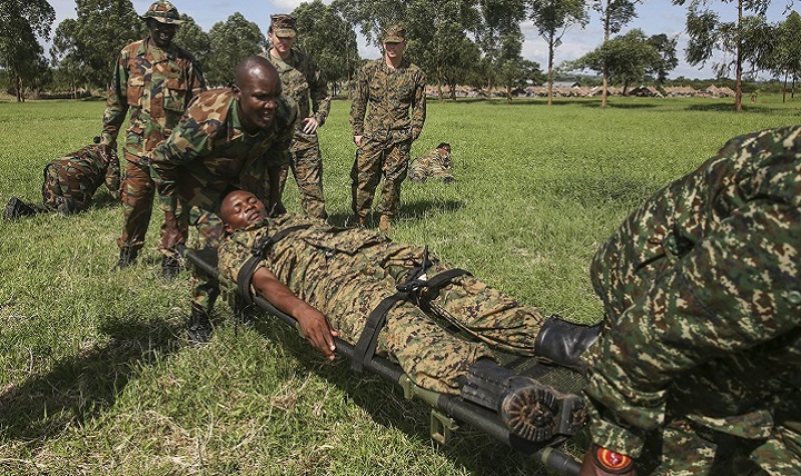 Uganda People’s Defense Force soldiers carry a notional injured soldier to a safe area during a tactical combat casualty care exercise at Camp Singo, Uganda.