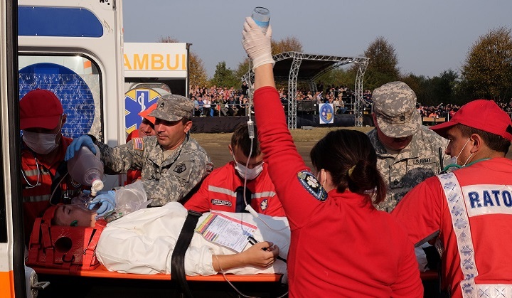 Army Staff Sgt. Nicu Tirnoveanu (left) and Army Staff Sgt. Douglas Clemence (right), both from Medical Support Unit-Europe, 7th Civil Support Command conduct triage on "patients" with simulated injuries during NATO consequence management exercise Ukraine 2015. (U.S. Army photo by Army Sgt. 1st Class Matthew Chlosta)