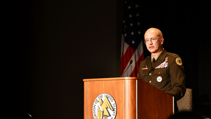 Image of Defense Health Agency Director Army Lt. Gen. (Dr.) Ronald Place speaking at an Expo. Click to open a larger version of the image.