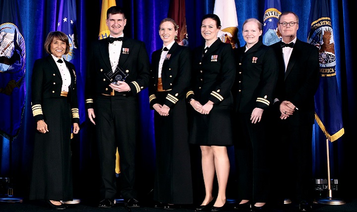 MHS “Advancements towards High Reliability in Health Care” Awards: Healthcare Quality and Patient Safety Awards - Walter Reed National Military Medical Center for “High Value Cost Conscious Care: Optimizing the Electronic Medical Record to Reduce Unnecessary or Redundant Lab Orders.” Pictured (left to right) are Navy Vice Adm. Raquel Bono, director, Defense Health Agency, Navy Lt. Brett Sadowski, Navy Lt. Cmdr. Alison Lane, Navy Lt. Sara Robinson, Navy Lt. Nora Maddy and Tom McCaffery, acting Assistant Secretary of Defense for Health Affairs. (Courtesy photo)