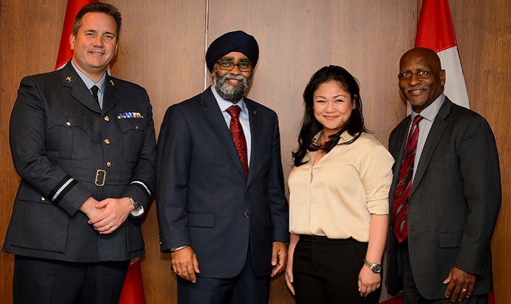 Air Commodore Rich Withnall, United Kingdom WC21 co-chair (left), Harjit Sajjan, Canada’s minister of national defence (center left), Dr. Dorothy Narvaez-Woods, special assistant to the assistant secretary of defense for health affairs (center right), and Mr. Bret Stevens, U.S. WC21 co-chair (right) pose for a photo following Minister Sajjan’s  keynote address. Senior representatives from 14 attending nations discussed their nations’ strategic priorities for warrior care. (Canadian Armed Forces photo by Corporal Lisa Fenton)