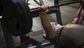 Military personnel performing a bench press