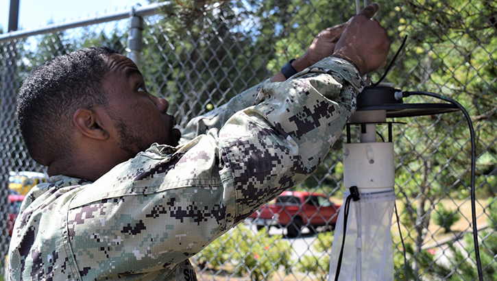 Naval Hospital Bremerton’s Hospital Corpsman 1st Class Justin Tyler Simmons, preventive medicine department leading petty officer and preventive medicine technician placed a carbon dioxide light trap used in conducting seasonal surveillance and prevention for West Nile vector control on U.S. Navy installations in the Pacific Northwest. (Photo: Douglas H Stutz, NHB/NMRTC Bremerton public affairs)