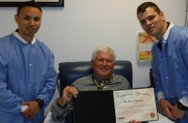 Pictured (Left to right): Navy Hospital Corpsman Third Class Castro, Peter Williams and Hospital Corpsman Third Class Nielsen. Castro and Nielsen present Williams a donor appreciation certificate at Pentagon Blood Donor Center.