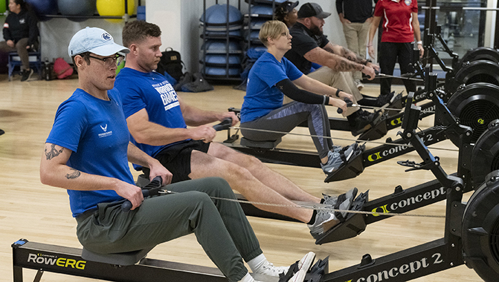 Recovering service members, veterans, and staff using a rowing machine