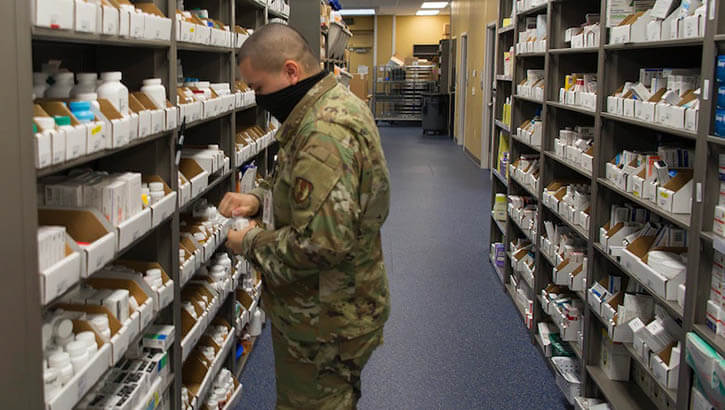 Air Force Staff Sgt. Nick Buckendahl, 88th Diagnostics and Therapeutics Squadron pharmacy technician, gathers medicine June 4, 2020, to fill a customer’s prescription in the Kittyhawk Pharmacy on Wright-Patterson Air Force Base, Ohio.