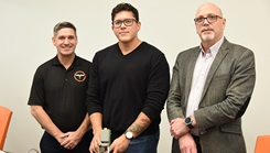 U.S. Army Institute of Surgical Research teammates U.S. Army Lt. Col. Brian Kirkwood, left, Carlos Bedolla, and Dr. Jose Salinas pose with the prototype of an ultrasound nerve block device that uses artificial intelligence to provide regional pain control in trauma patients while they are still at or near the point of injury