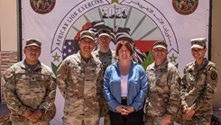 U.S. Army Capt. C. Ian Davis, third from left, deputy chief of the Applied Diagnostics Branch at the U.S. Army Medical Research Institute of Infectious Diseases, poses for a group photo 