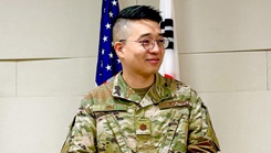 U.S. Air Force Maj. Shawn Kim gives a speech during a ceremony celebrating his promotion