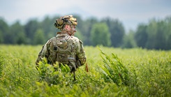 U.S. Air Force Staff Sgt. Caden Getty, a security forces Airman assigned to the 158th Fighter Wing, stands guard while his team awaits medevac 