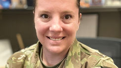 U.S. Air Force Master Sgt. Samantha Berkemeyer smiles in an office