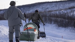 Exercise Special Operations Forces Arctic Medic 2025 participants transport a simulated combat casualty using a CASEVAC Ecosystem sled prototype at Yukon Training Area