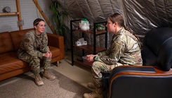 From left, U.S. Air Force Maj. Katelyn Allen, 378th Expeditionary Medical Squadron dentist and Maj. Robin Morris, 378th EMDS Functional Medicine Flight licensed clinical social worker, converse within the U.S. Central Command area of responsibility