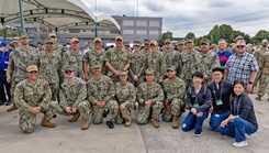 Sailors assigned to U.S. Navy Medicine Readiness and Training Command Yokosuka and U.S. Navy Medicine Readiness and Training Unit Atsugi pose for a group photo with Japanese Fellows