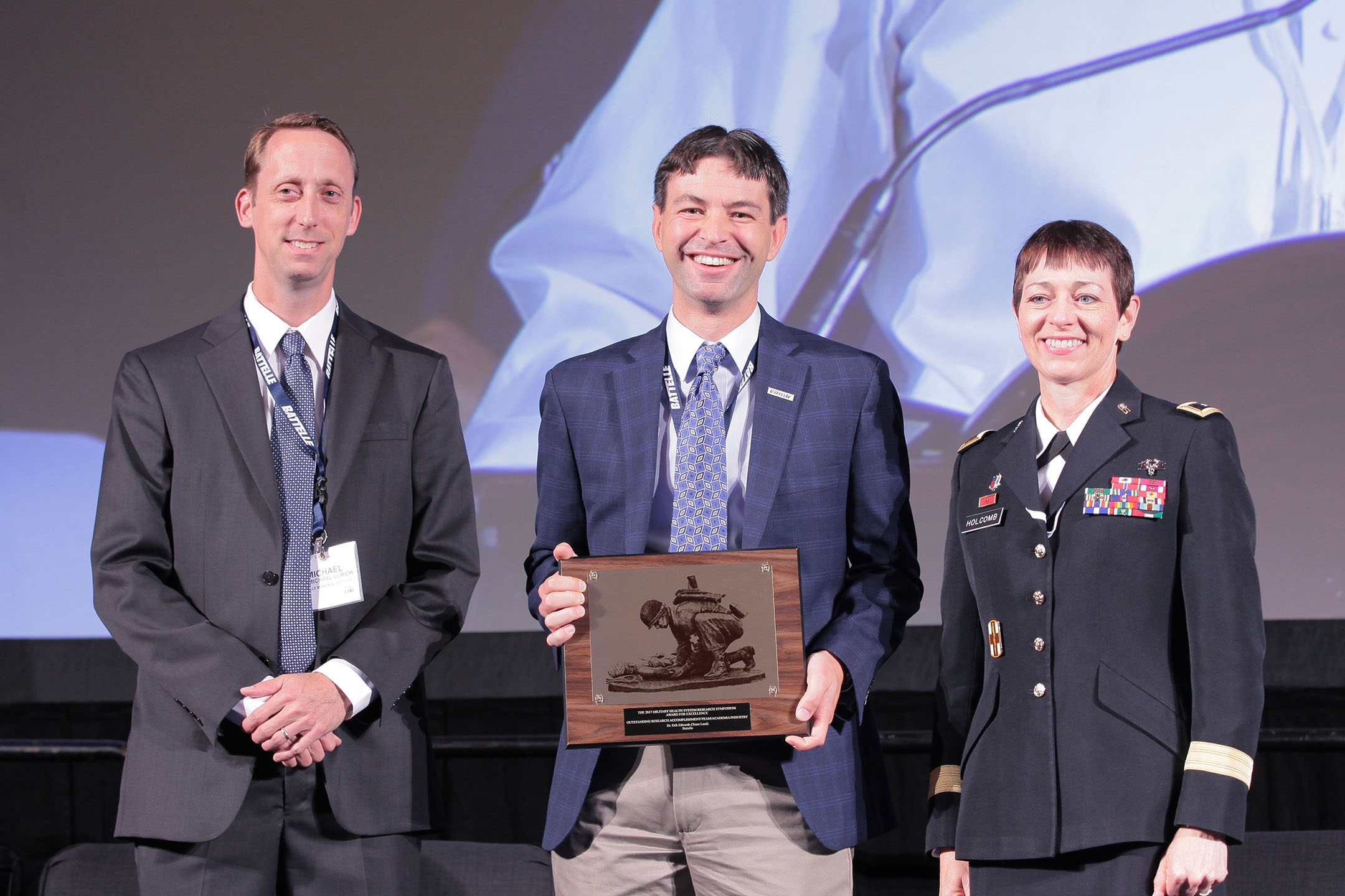 Major General Barbara R. Holcomb, commanding general of the U.S. Army Medical Research and Materiel Command, presented the Battelle team, supporting the Office of Naval Research, with the 2017 Team Research Accomplishment (Academia), in the category of Combat Casualty Care, on Aug. 28 at the Military Health System (MHS) Research Symposium. The team was recognized for their work with the Acute Care Covering for Severely Injured Limbs project to develop an oxygen-generating pump that makes oxygen available to wounds that require the use of a tourniquet.