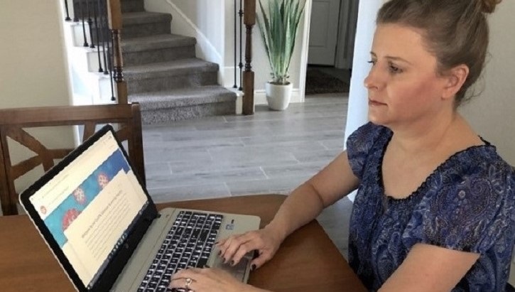 Image of Woman typing on laptop. Click to open a larger version of the image.