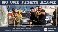 A graphic of military personnel pulling a truck, with the phrase 'No one fights alone'