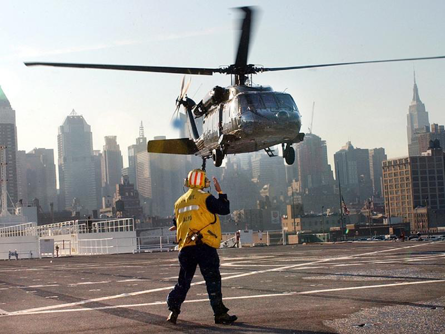 Link to Photo: COMFORT flight deck personnel also assisted the city and other government agencies that required helicopter landings and layovers.  In fact, New York officials designated the ship as the secure location for emergency landings for VIP personnel.  