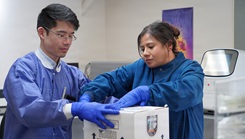 David Chou, principal investigator of the 'A Virtual Astronaut Tissue Analog  Response' (AVATAR) investigation, and Erica Duarte, Lab Safety and Logistics Supervisor at Naval Research Center (NHRC), place extracted specimens into a secure package for transport, further tests and analysis. 