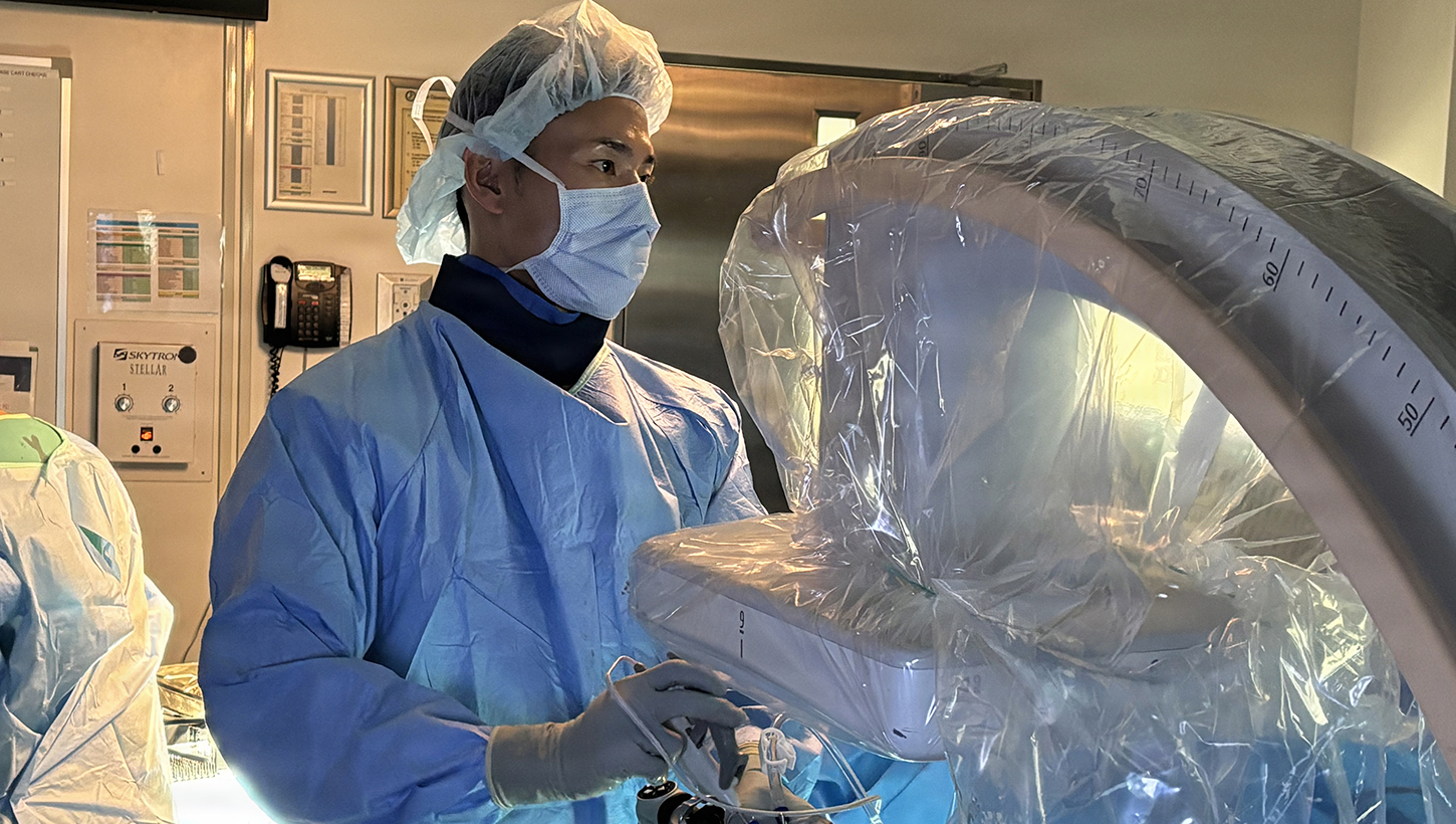 Lt. Cmdr. Ki Chang a Navy Medical Corps Officer and Staff Neurosurgeon working on a procedure