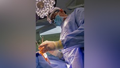 Capt. Matthew Keller, an ear, nose and throat and facial plastic surgeon assigned to U.S. Naval Hospital (USNH) Yokosuka performs a functional septorhinoplasty and inferior turbinate reduction under surgical lighting in an operating room. 