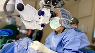A doctor performing a surgery