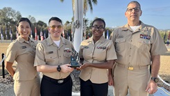 U.S. Navy Cmdr. Jennifer Francis, U.S. Navy Hospital Corpsman 2nd Class Taylor Keene, U.S. Navy Hospital Corpsman 2nd Class Shakirah Peterson-Wall, and U.S. Navy Cmdr. James Zmijski, members of U.S. Navy Medicine Readiness and Training Command, display the Association of periOperative Registered Nurses “Go Clear” Award