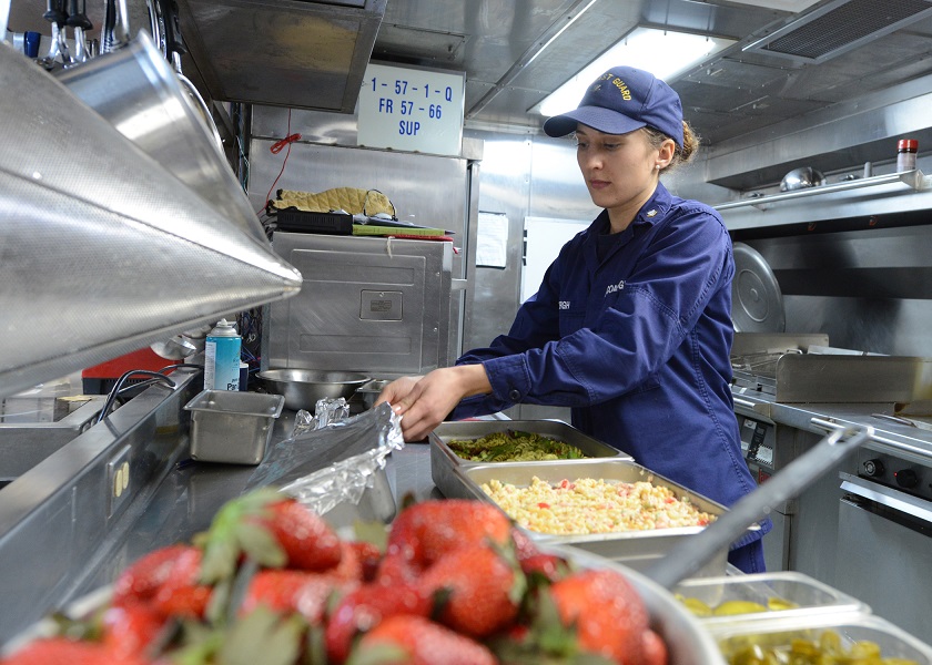 Coast Guard Petty Officer 3rd Class Salle Bergh, a food service specialist aboard the Coast Guard Cutter Spar, prepares a meal for the ship's crew. Bergh, along with her fellow chefs, has made healthy recipe alterations to common menu items to help the crew eat healthier, more nutritious meals. (U.S. Coast Guard photo by Petty Officer 3rd Class Diana Honings)