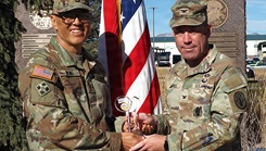 Sgt. 1st Class David Hong, a religious affairs specialist currently assigned to the Fort Carson Soldier Recovery Unit, presents his 2025 Warrior Games “Heart of the Team” award to Col. Matthew Mapes, the Evans Army Community Hospital commander, in a ceremony at Manhart Field on Nov. 25, 2025.