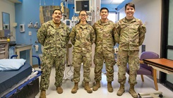 Chief Eric Garcia, Sgt. Ariane Nunley, Senior Airman Victor Maldonado, and Senior Airman Brett Lucas pose for a photo after the conclusion of their annual equipment checks