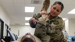 7457th Medical Operational Readiness Unit facilitates, augments Eastern Phoenix 2025 Photo By Sgt. 1st Class Christopher Hernandez | Army Reserve Sgt. Delila Jones, a physical therapy specialist with the Richmond, Va. 7457th Medical Operational Readiness Unit, performs a leg stretch on Sgt. Randy McCartney, a tactical power generation specialist with the 7457th MORU, during Eastern Phoenix 2025 training exercise at the Dwight D. Eisenhower Army Medical Center in Fort Gordon, Ga., Aug. 6, 2025. 39 Soldiers of the 7457th MORU facilitated in teh setup of, and augmented the staffing and support of, the Army Active Component in the annual patient movement and hospital bed expansion exercise. (U.S. Army Reserve photo by Sgt. 1st Class Christopher Hernandez) 